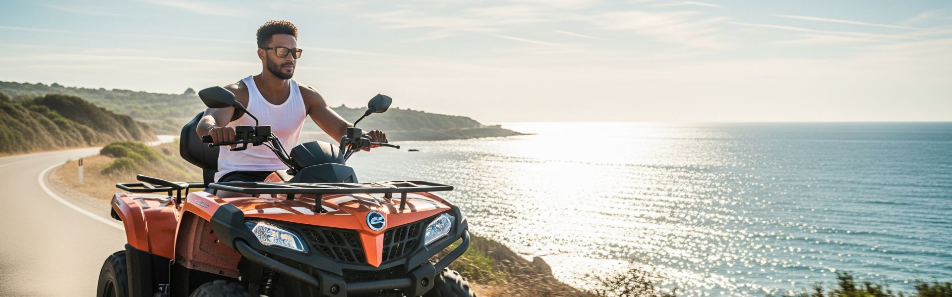 A young man on a rental ATV enjoys a scenic ride along the coast in Zakynthos