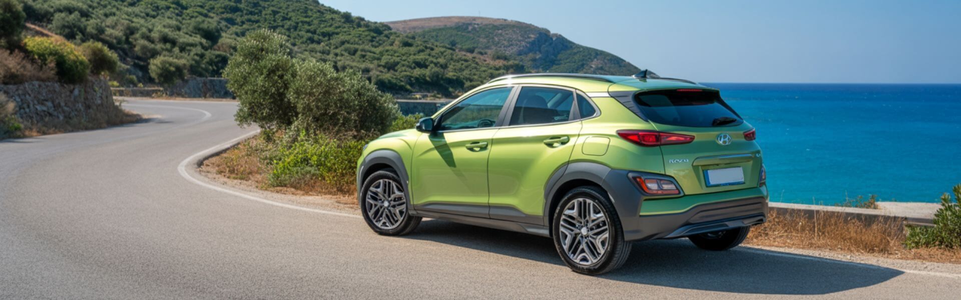 A bright green rental car sits peacefully along the winding coastal road in Zakynthos.